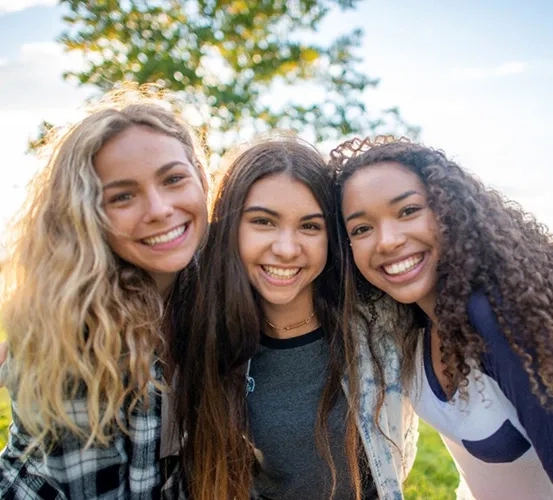 a group of girls smiling